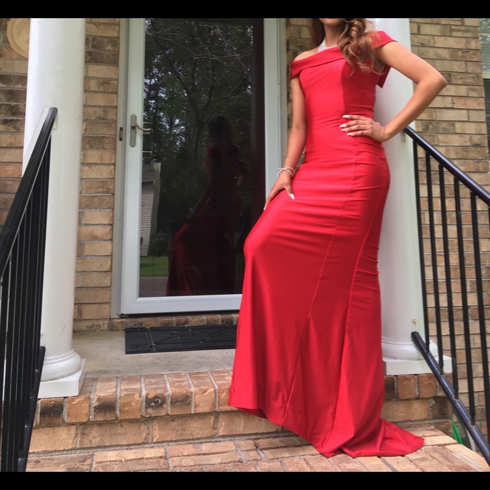 Red off shoulder floor length dress.